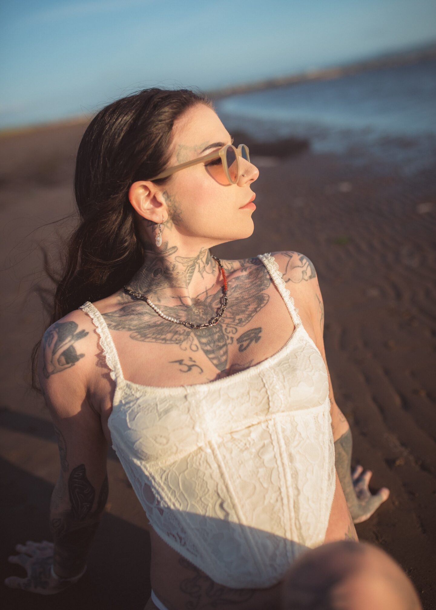 A picture of Eve at Troon beach wearing LGR sunglasses.