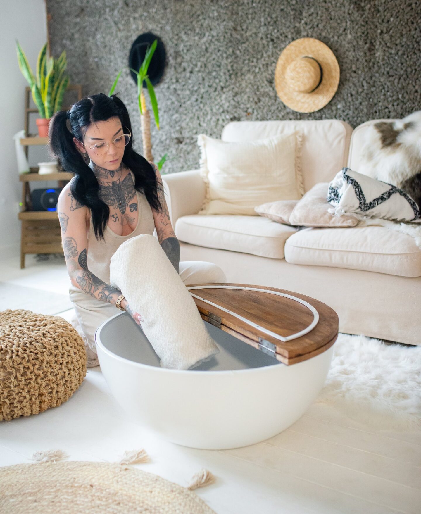 A picture of Eve Sara using the Mango wood industrial coffee table by Creation Furniture.