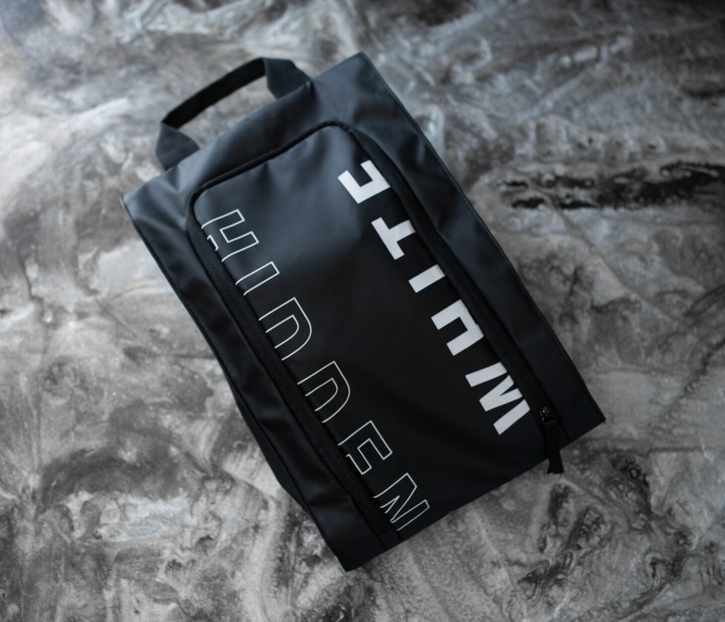 A picture of Hidden White Asher shoes inside the travel bag they come in.