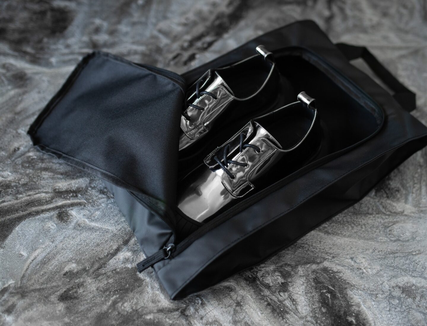 A picture of the Asher Oxford shoes in their travel bag.