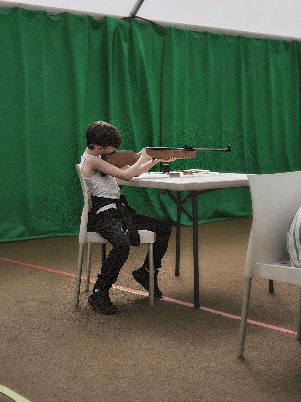 A picture of Eve Sara's son Isaac at Haggerston doing rifle shooting.