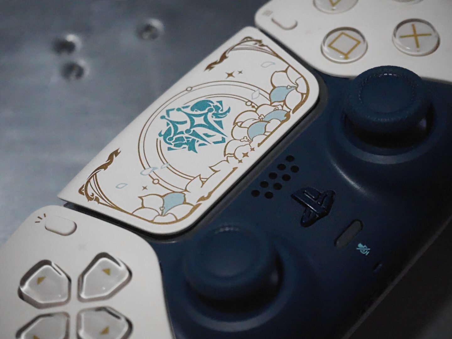 A close up of the new Genshin Impact Duelsense controller in detail.