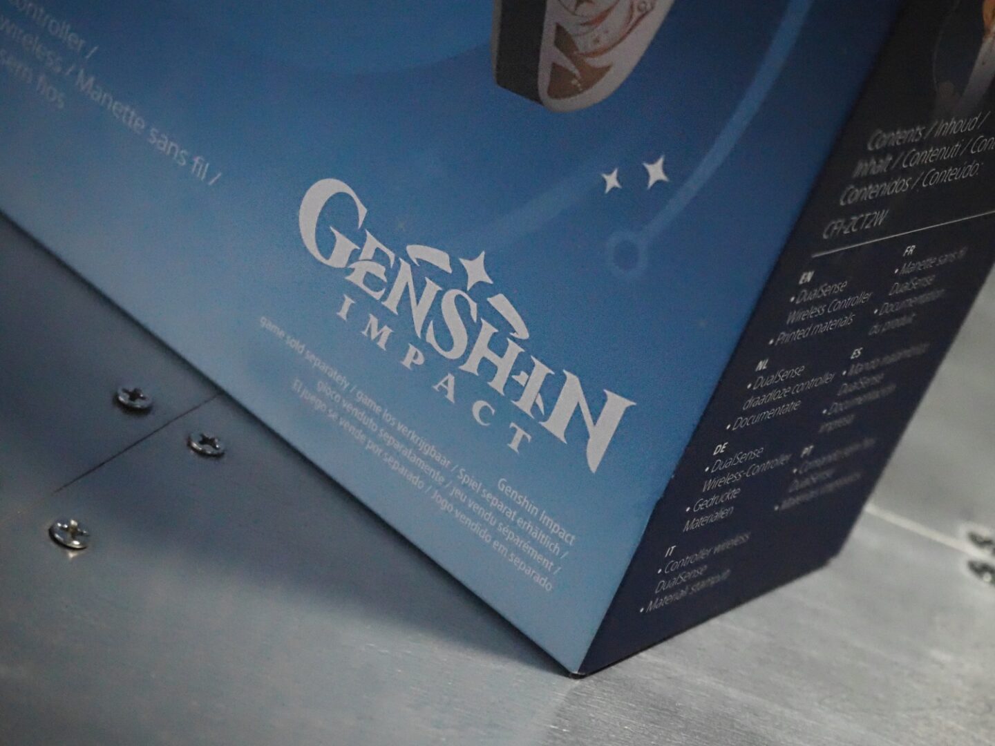 A picture of a close up of the Genshin Impact controller box from Playstion.