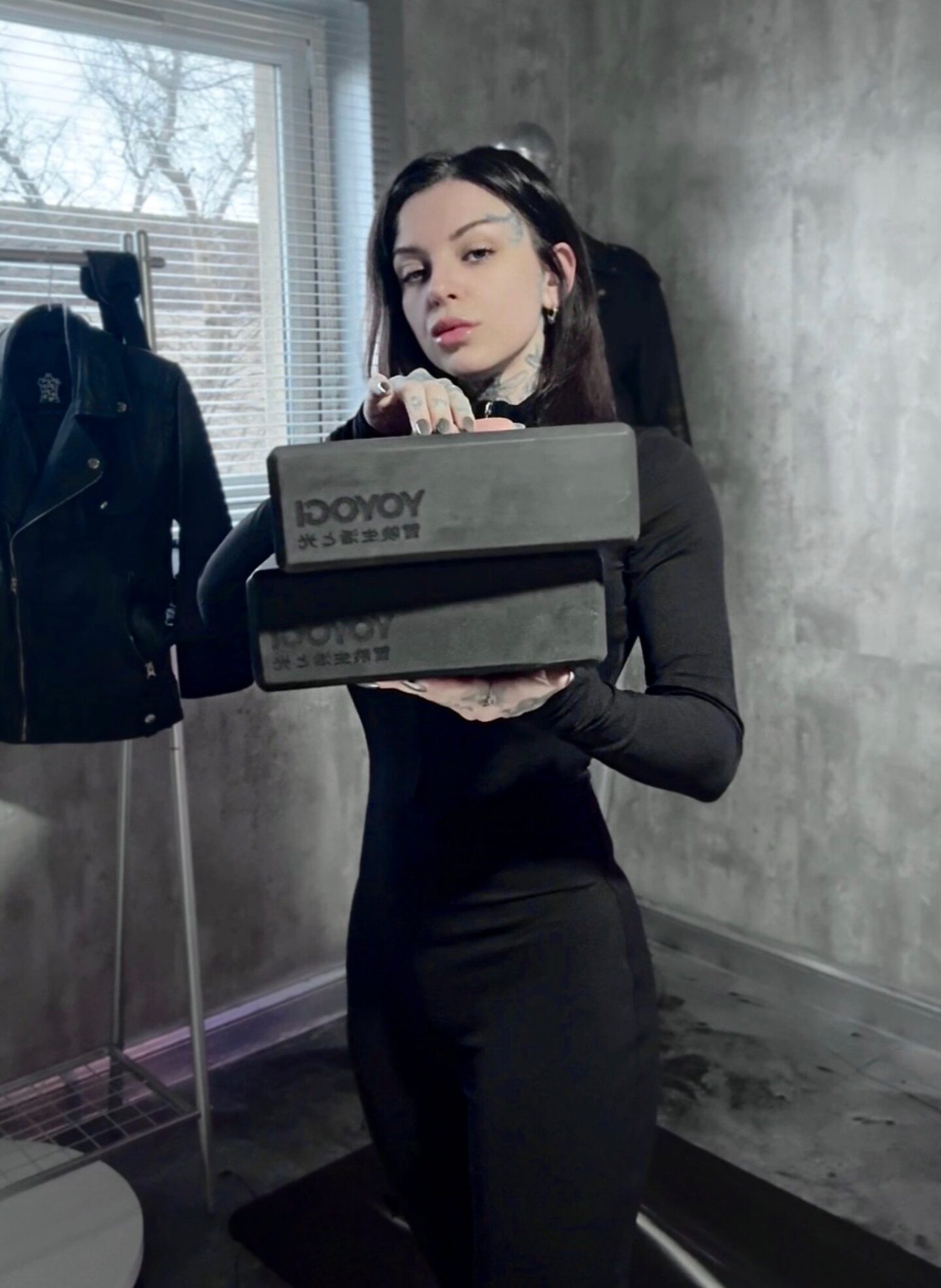 A picture of Eve Sara holding the yoga blocks from Yoyogi.