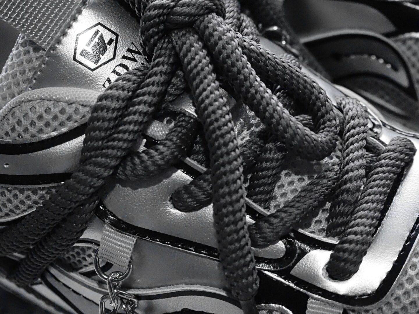 A close up of the Jupiter 10 - silver sneakers laces from Anthony Wang.