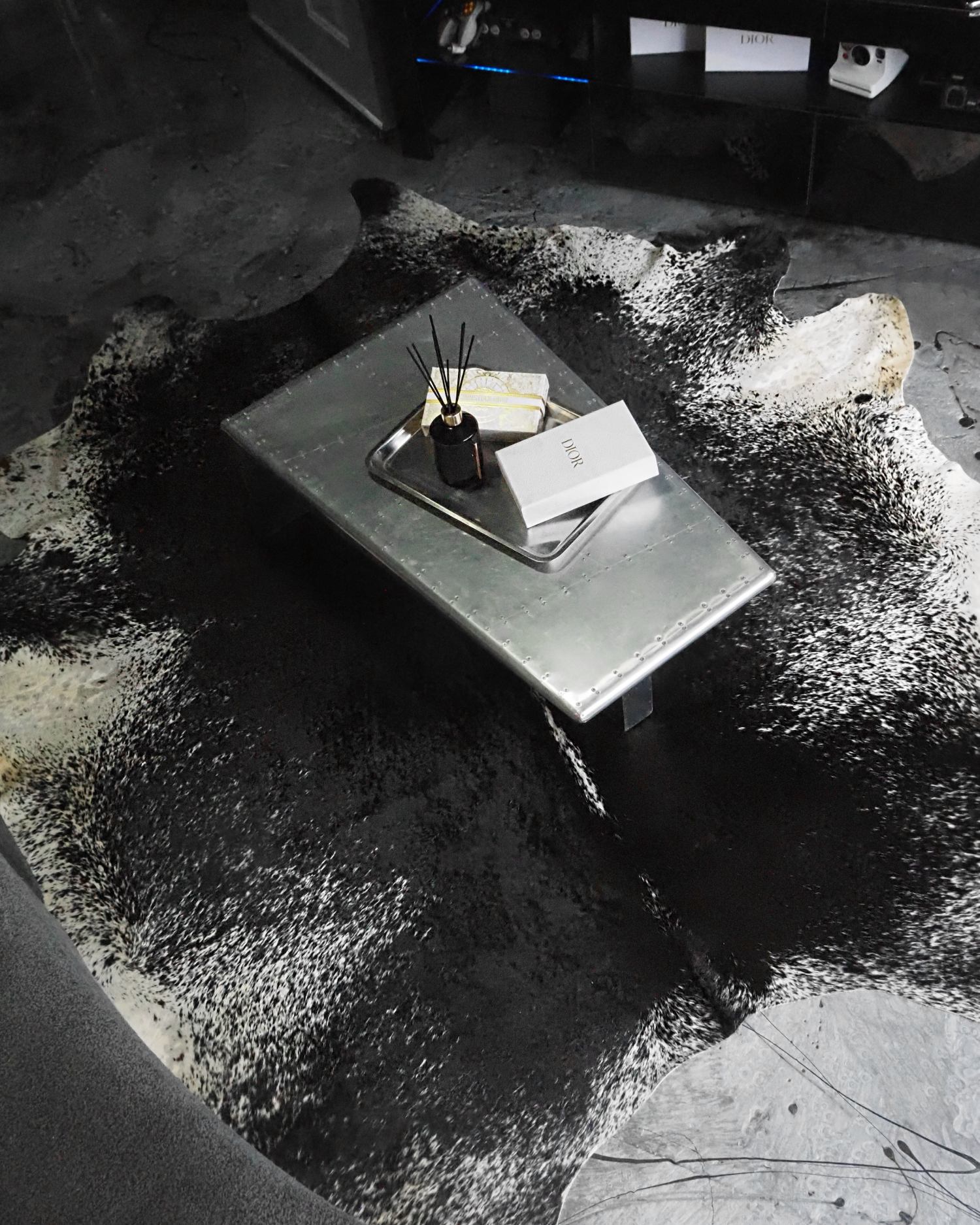 A picture of the black & white speckled rug from Eastern Countries leathers inside Eve McIntosh's house.